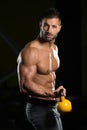 Biceps Exercise With Kettle-bell In A Gym Royalty Free Stock Photo