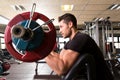 Biceps preacher bench arm curl workout man at gym Royalty Free Stock Photo