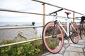bicicleta aparcada sobre una barandilla con unas hermosas vistas al mar Royalty Free Stock Photo