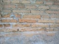 Bricks in walls with holes because they were pecked by birds Royalty Free Stock Photo