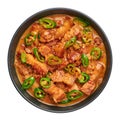 Bicol Express Stew in black bowl isolated on white. Filipino cuisine spicy pork belly coconut milk curry. Asian food