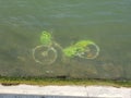 A bicycle abandoned under the water