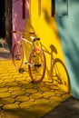 Bicycle against a vibrant wall outdoors