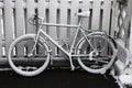 Snowy bicycle after a snowstorm.