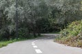 Bicycle asphalt road curve in green city park Royalty Free Stock Photo