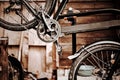 Bicycle on the assembly stand for maintenance and repair, technical abstract image desaturated and with blurred background