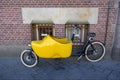 Bicycle with a baby stroller in the form of Dutch shoes Klomp