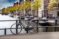 Bicycle on the bridge on the canal of Amsterdam Royalty Free Stock Photo