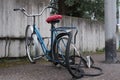 Bicycle with a broken crumpled wheel in the parking lot Royalty Free Stock Photo