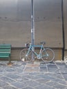 Bicycle chained to a lamppost in town
