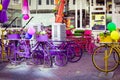 Bicycle with colorful flowers basket next to a tandoori tea restaurant