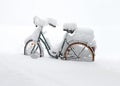 bicycle covered with a layer of snow Royalty Free Stock Photo