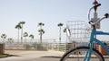 Bicycle cruiser bike by ocean beach, California coast USA. Summertime cycle, stairs and palm trees. Royalty Free Stock Photo