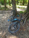 Broken Hybrid Electric Bike with wood background Royalty Free Stock Photo