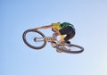 Bicycle, cyclist man and jump of adrenaline junkie from below riding in a competition with copyspace. Extreme sport Royalty Free Stock Photo