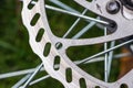 Bicycle disk brake rotor in focus. Metal details of transport concept Royalty Free Stock Photo