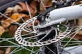 Bicycle disk brake rotor in focus. Metal details of transport concept Royalty Free Stock Photo
