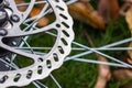 Bicycle disk brakes close up, grey metal disc attached to bike wheel, effective popular mountain bicycle brakes Royalty Free Stock Photo