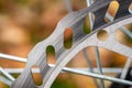 Bicycle disk brakes close up, grey metal disc attached to bike wheel, effective popular mountain bicycle brakes Royalty Free Stock Photo