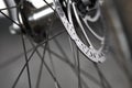 Bicycle disk brakes close up, metal disc attached to bike wheel, effective mountain bicycle brakes Royalty Free Stock Photo