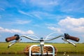 Bicycle, field and blue sky with clouds. Travel