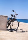 Bicycle on the fishing port over blue sea Royalty Free Stock Photo