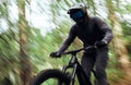 Bicycle, forest and man travel, speed and workout outdoor in woods for healthy body. Mountain bike, nature and athlete