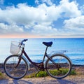 Bicycle in formentera beach with Ibiza sunset