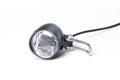 Bicycle front headlight on a white background. Bicycle light with black wire. Bicycle headlight. Royalty Free Stock Photo