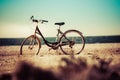 Bicycle in front of the sea, teal and orange style Royalty Free Stock Photo