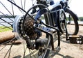 Bicycle gear wheels in close up with mechanic gears cassette and chain at the rear wheel of folding bike Royalty Free Stock Photo