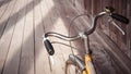 Bicycle handle bar close up wooden floor background Royalty Free Stock Photo