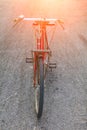 Bicycle Handle red classic vintage in former beautiful on the road with light sunrise tone Royalty Free Stock Photo