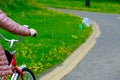 Bicycle handlebar in the hands of a rebec on a blurred background of grass with space for text Royalty Free Stock Photo