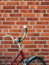Bicycle handlebar leaning on to brick wall in Halmstad, Sweden Royalty Free Stock Photo