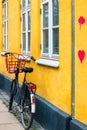 Bicycle with heart on yellow house wall in Copenhagen Royalty Free Stock Photo