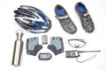 Bicycle helmet, glasses, gloves, bottle, walkie-talkie, camera and cycling shoes on a white background Royalty Free Stock Photo