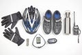 Bicycle helmet, glasses, gloves, bottle, walkie-talkie, camera and cycling shoes on a white background Royalty Free Stock Photo