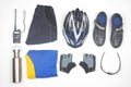 Bicycle helmet, glasses, gloves, bottle, walkie-talkie, sportswear and cycling shoes on a white background Royalty Free Stock Photo