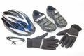 Bicycle helmet, glasses, gloves and cycling shoes on a white background Royalty Free Stock Photo