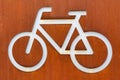 White bicycle sign on a corten steel rusted background Royalty Free Stock Photo