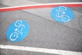 Bicycle lane blue sign on an asphalt street Royalty Free Stock Photo