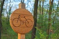 Bicycle lane sign indicating bike route wooden