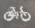 Bicycle lane sign on street surface Royalty Free Stock Photo