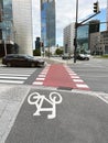 Bicycle lane with white sign painted and pedestrian crossing on asphalt road Royalty Free Stock Photo