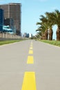 Bicycle lane with yellow dividing lines painted on asphalt, closeup Royalty Free Stock Photo