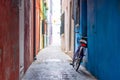 A bicycle leaning against a blue wall Royalty Free Stock Photo