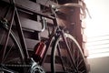 Bicycle leaning against the wall fence in the dark Royalty Free Stock Photo