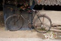 Bicycle leaning on wall in Kumrokhali, India