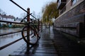 Bicycle locked to a fence near the river flowing through Cambridge city, place where a bicycle is not allowed to be locked. Royalty Free Stock Photo